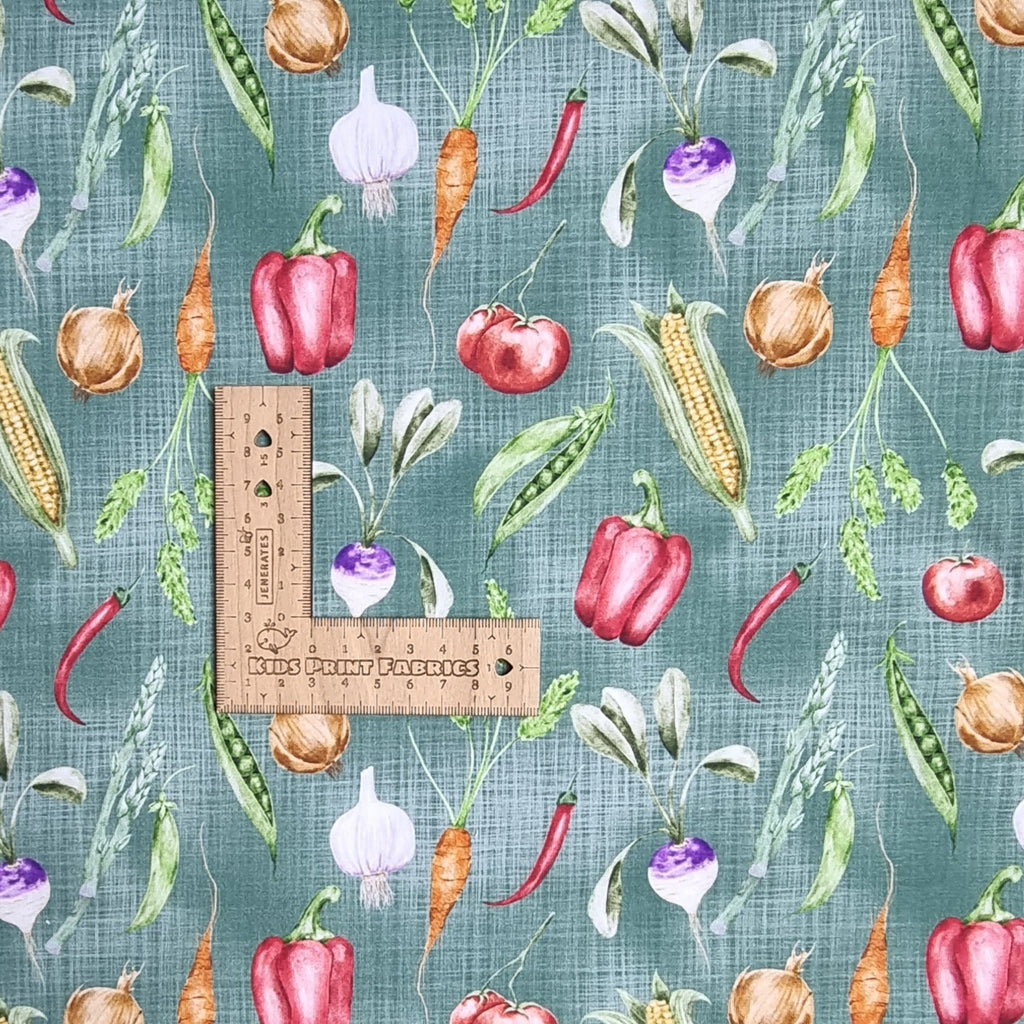 Teal textured background with vegetables fabric 