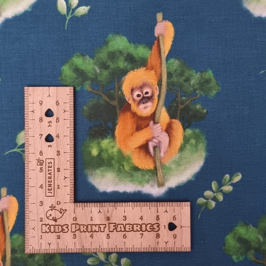 orangutan fabric with green background - KP Fabrics